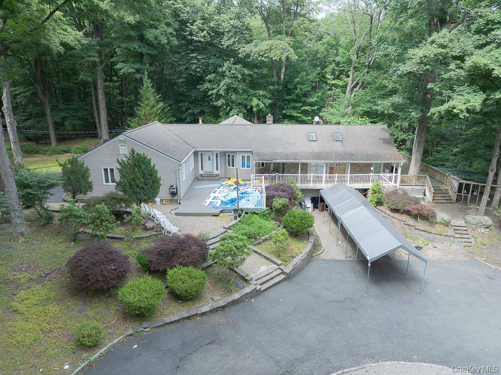 Set on 1. 6 acres in the unincorporated Town of Ramapo, this lush, tree lined property offers a spacious single family home with privacy and charm just minutes from town.