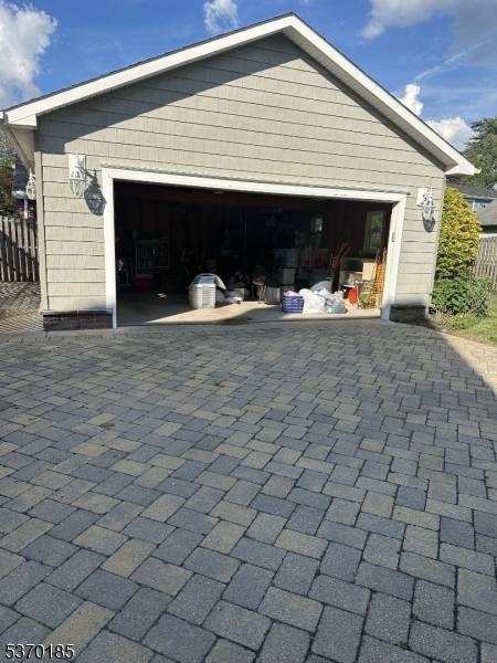 Nestled on a tree lined street, this beautifully maintained 4 bedroom Cape Cod offers a perfect blend of classic charm and modern convenience.