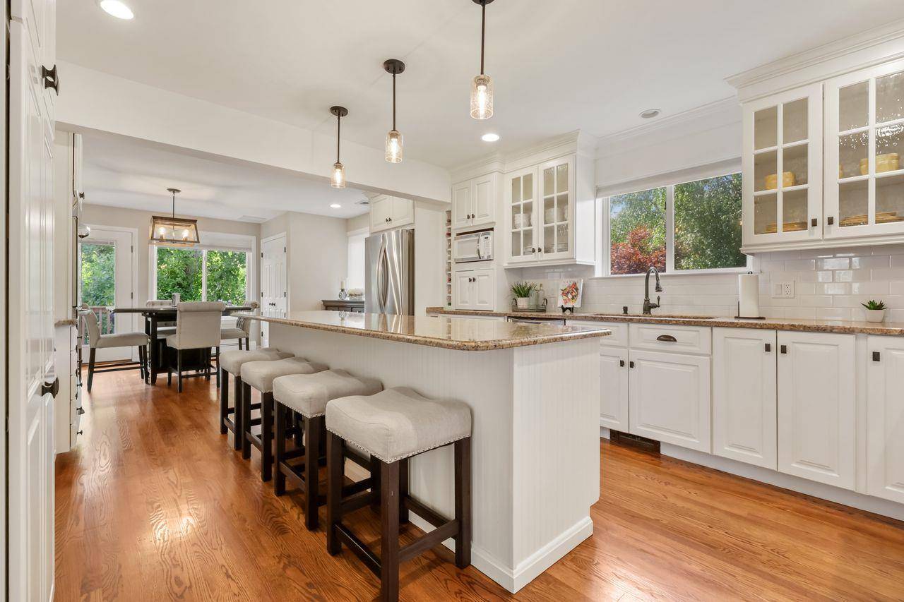 Completely Updated Sprawling Ranch offering 3, 600 Sq Ft of Refined Living Space, ideal for extended family living !
