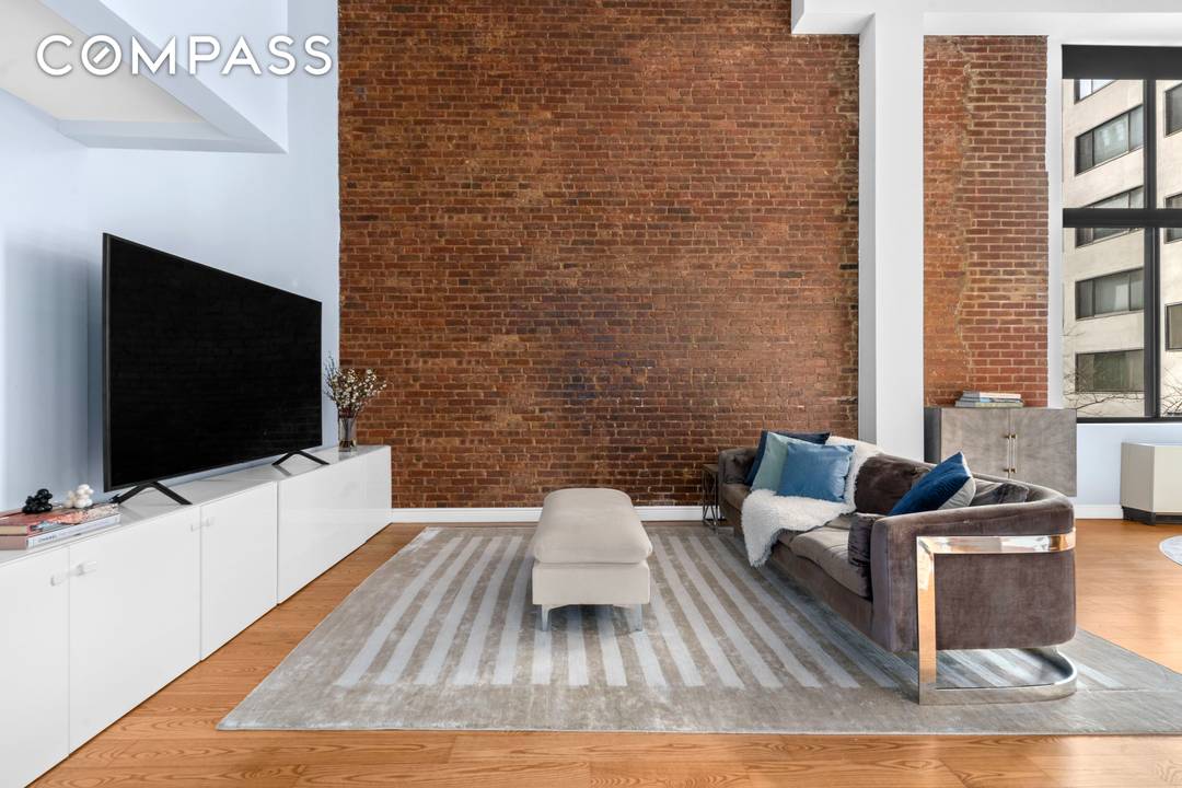 Welcome to 77 Bleecker Street, 320 an architecturally striking one bedroom, two bathroom duplex loft in the heart of NoHo.