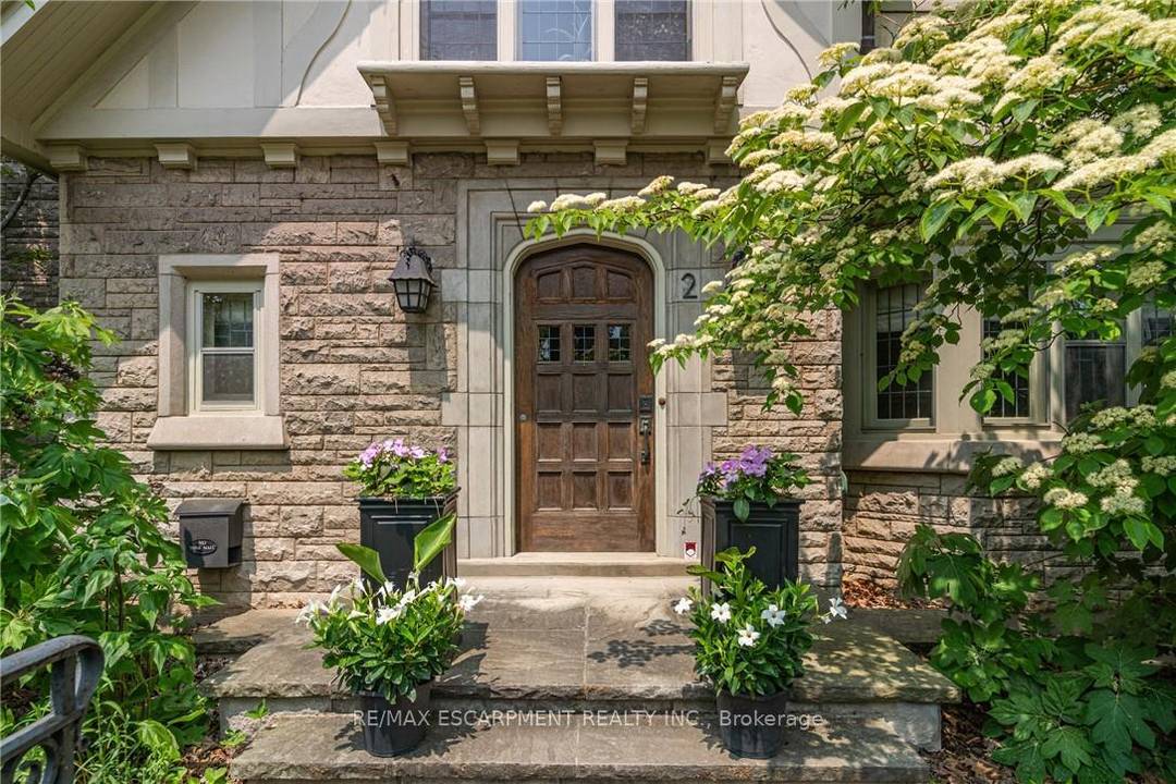 Perfectly positioned in the highly sought after and walkable Westdale North neighbourhood, this distinguished Tudor Revival residence masterfully blends timeless architectural character with sophisticated modern living.