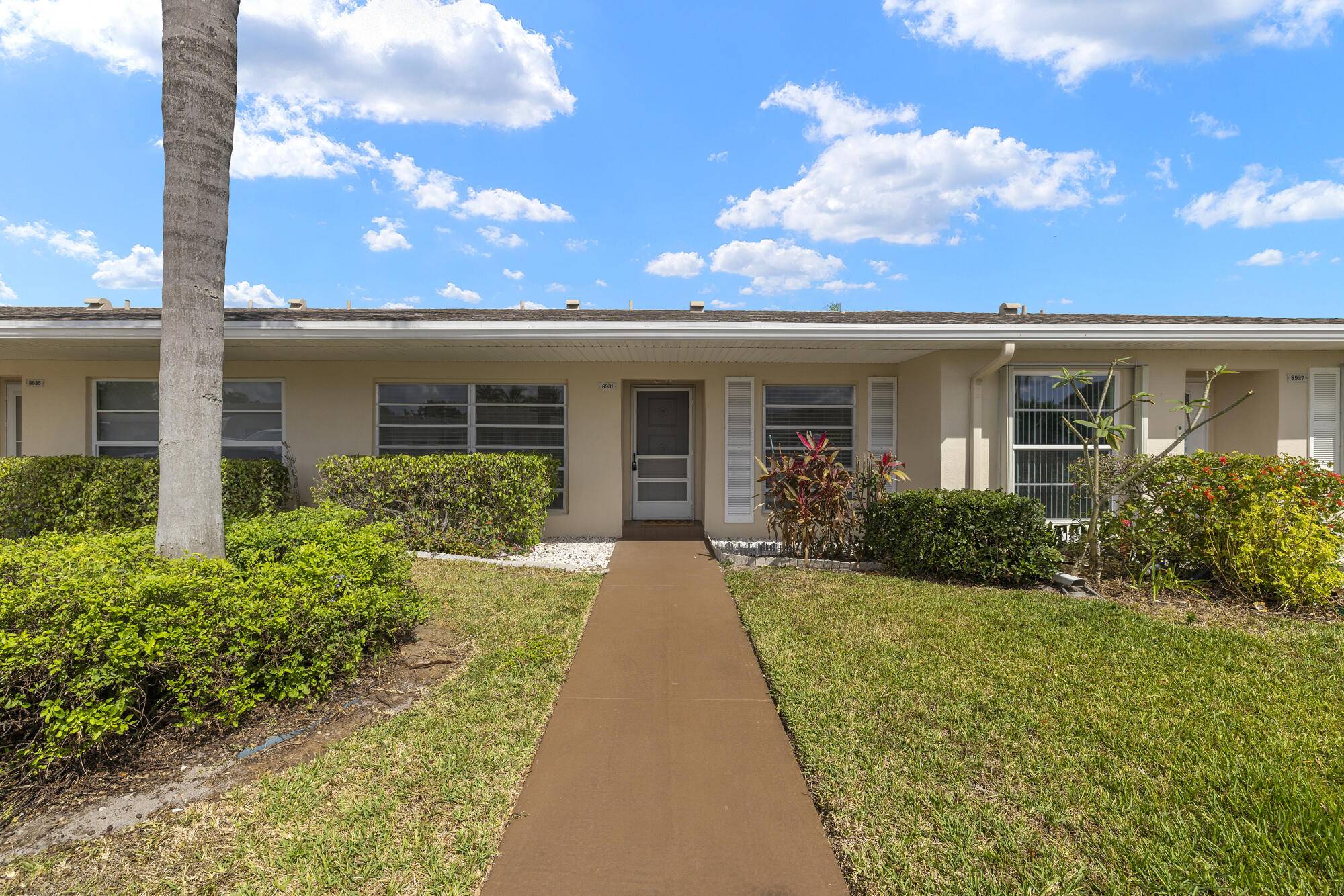 Discover this charming 55 condo in the serene, gated community of Boca Lakes.