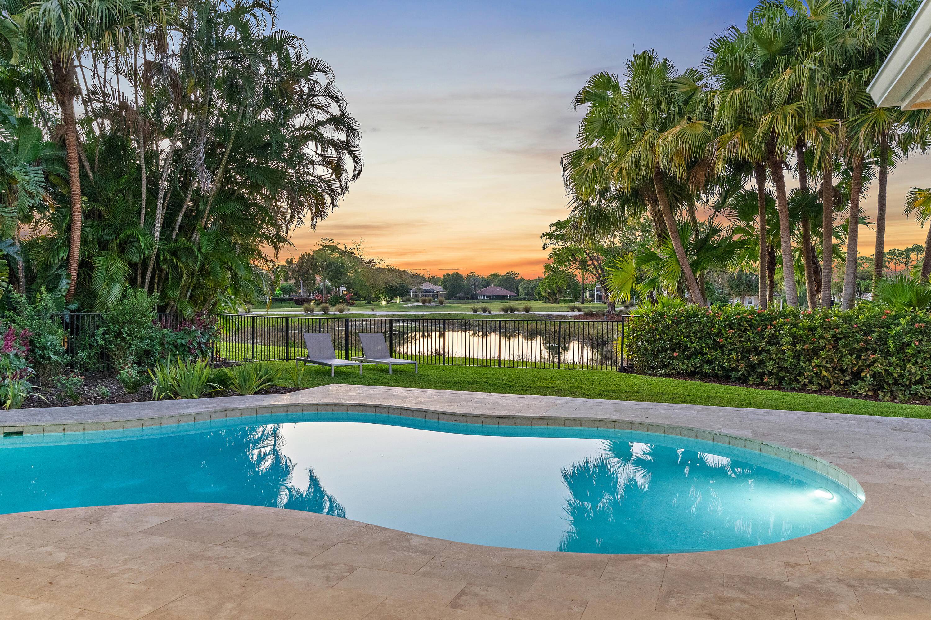 Exceptional Golf Front Home in PGA National Fully Renovated Move In ReadyWelcome to luxury living overlooking the scenic 6th hole of the prestigious Match golf course.