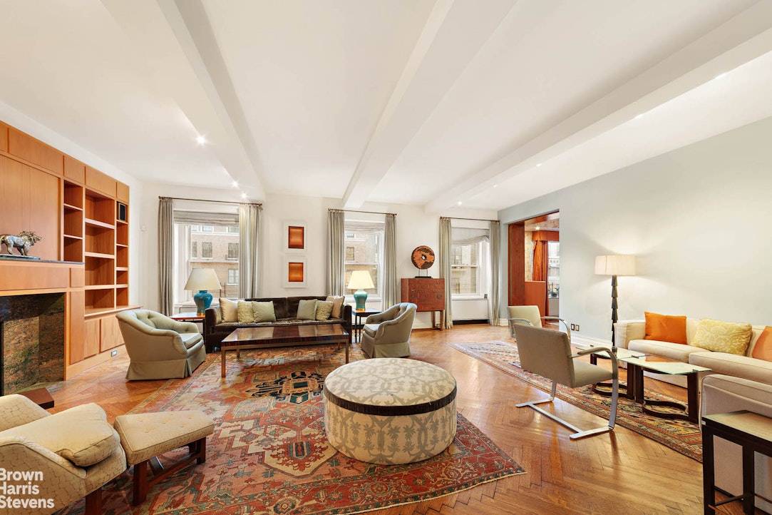 This fabulous and enormous high floor duplex in a top white glove prewar features huge south facing windows and light and air in every single room !