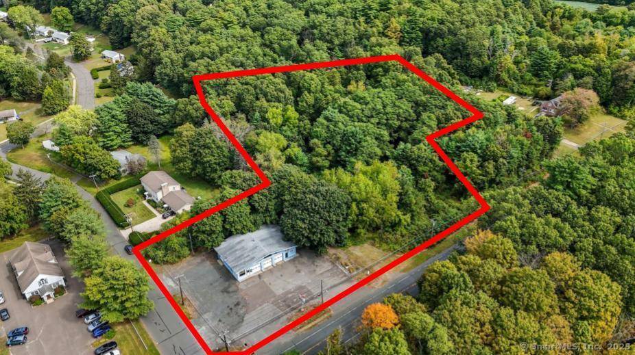 Five bay former auto repair facility with separate, adjacent wooded parcel, totaling approximately 4.