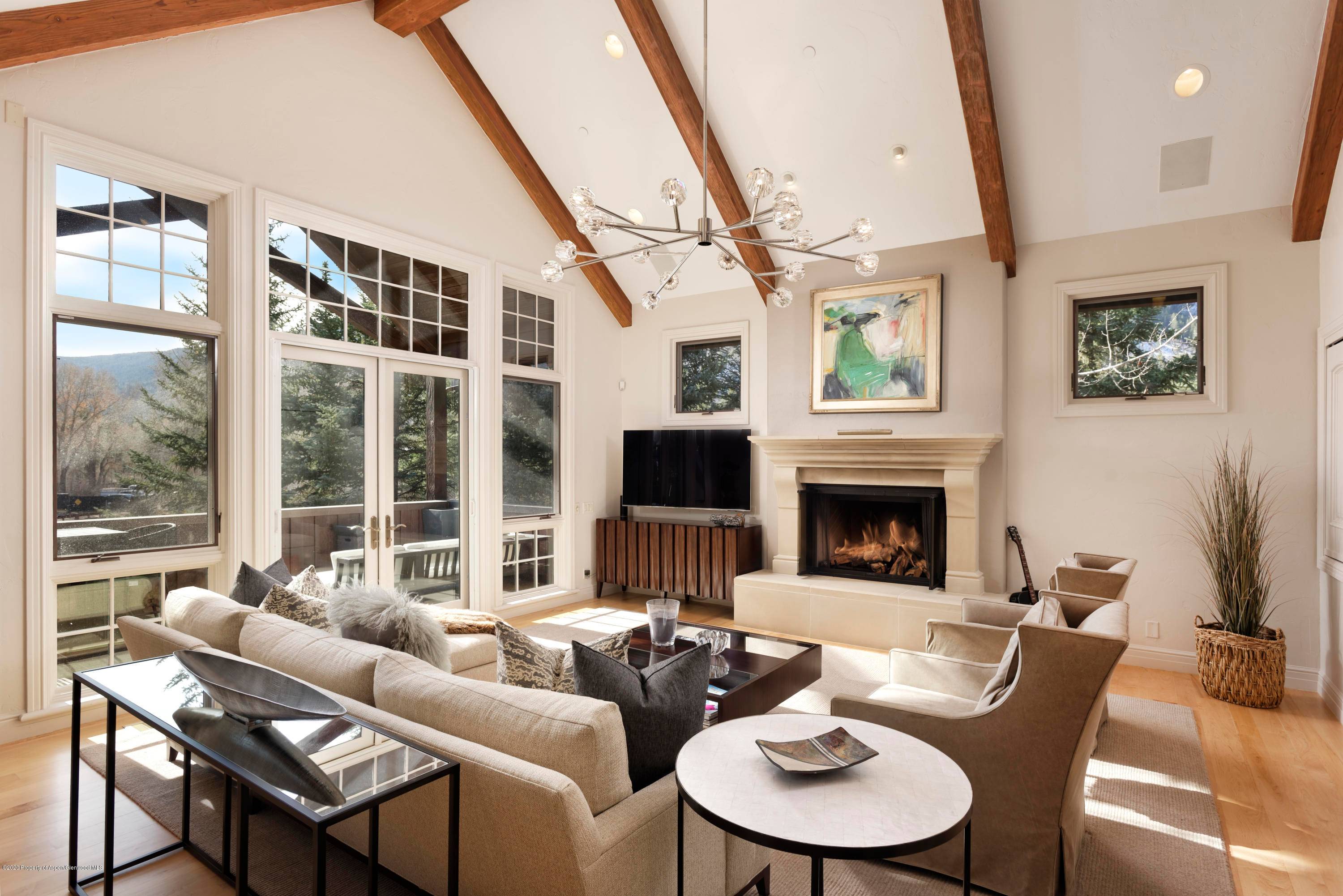 Welcome to this sophisticated and elegantly appointed four bedroom half duplex, conveniently located just one mile east of downtown Aspen and adjacent to the North Star Preserve.