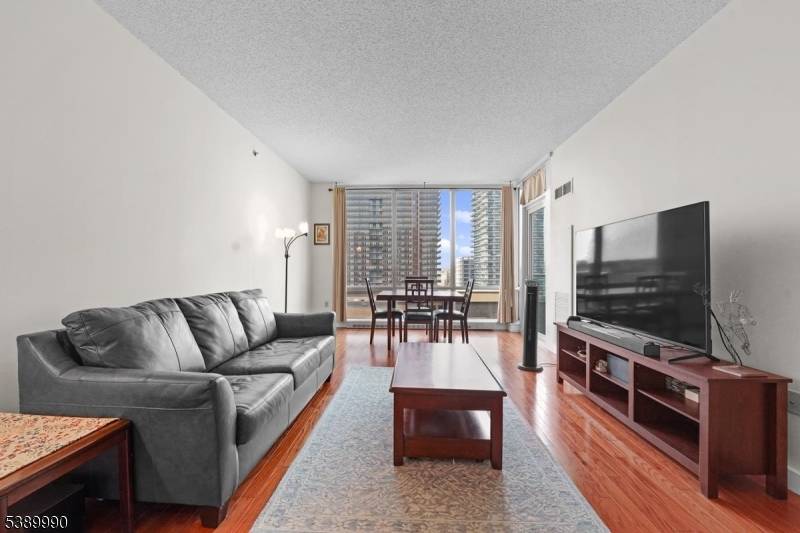 1 Bedroom Condo with Private Balcony Luxe Amenities Prime Jersey City Location Welcome to this beautifully maintained 1 bedroom, 1 bathroom home offering 840 sq ft of thoughtfully designed living ...