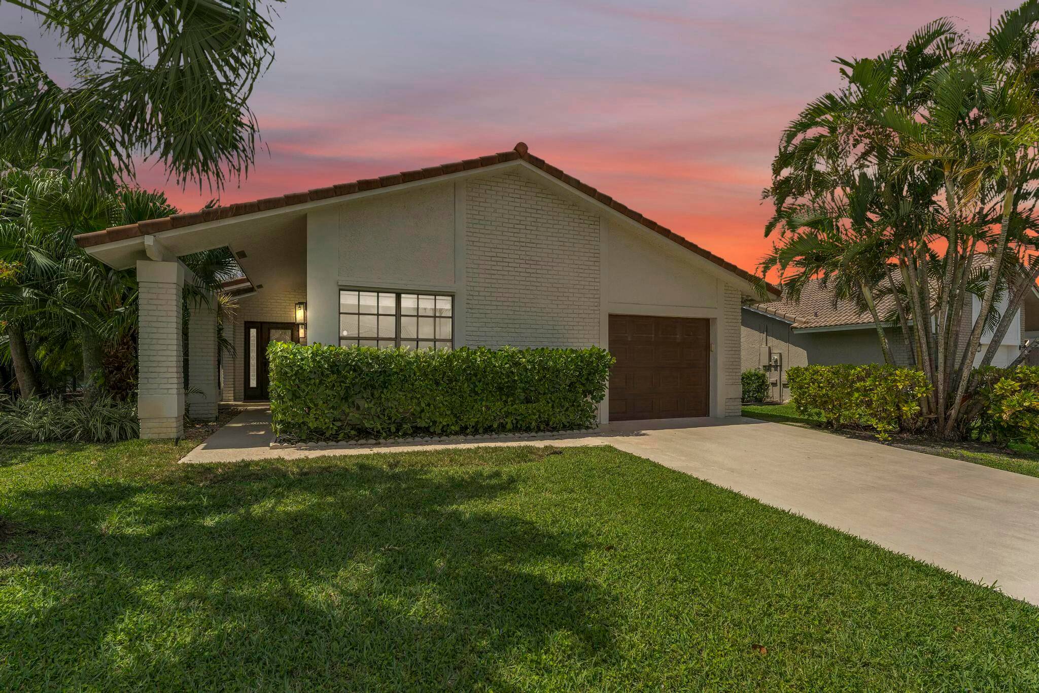 Beautifully updated 3 bedroom, 3 bathroom home located in the highly desirable, gated community of Boca Greens.