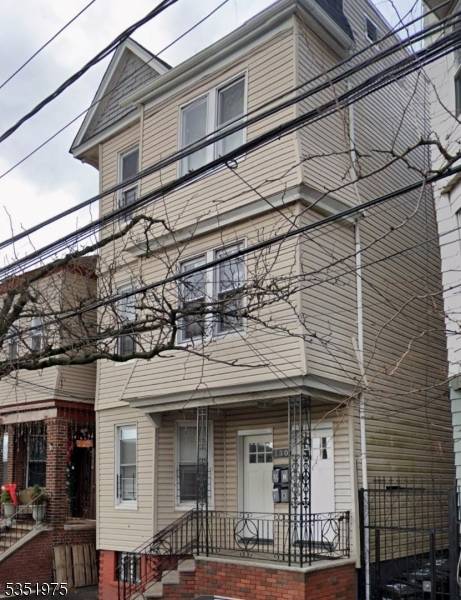 MOVE IN READY 3 FAMILY WITH FINISHED BASEMENT !