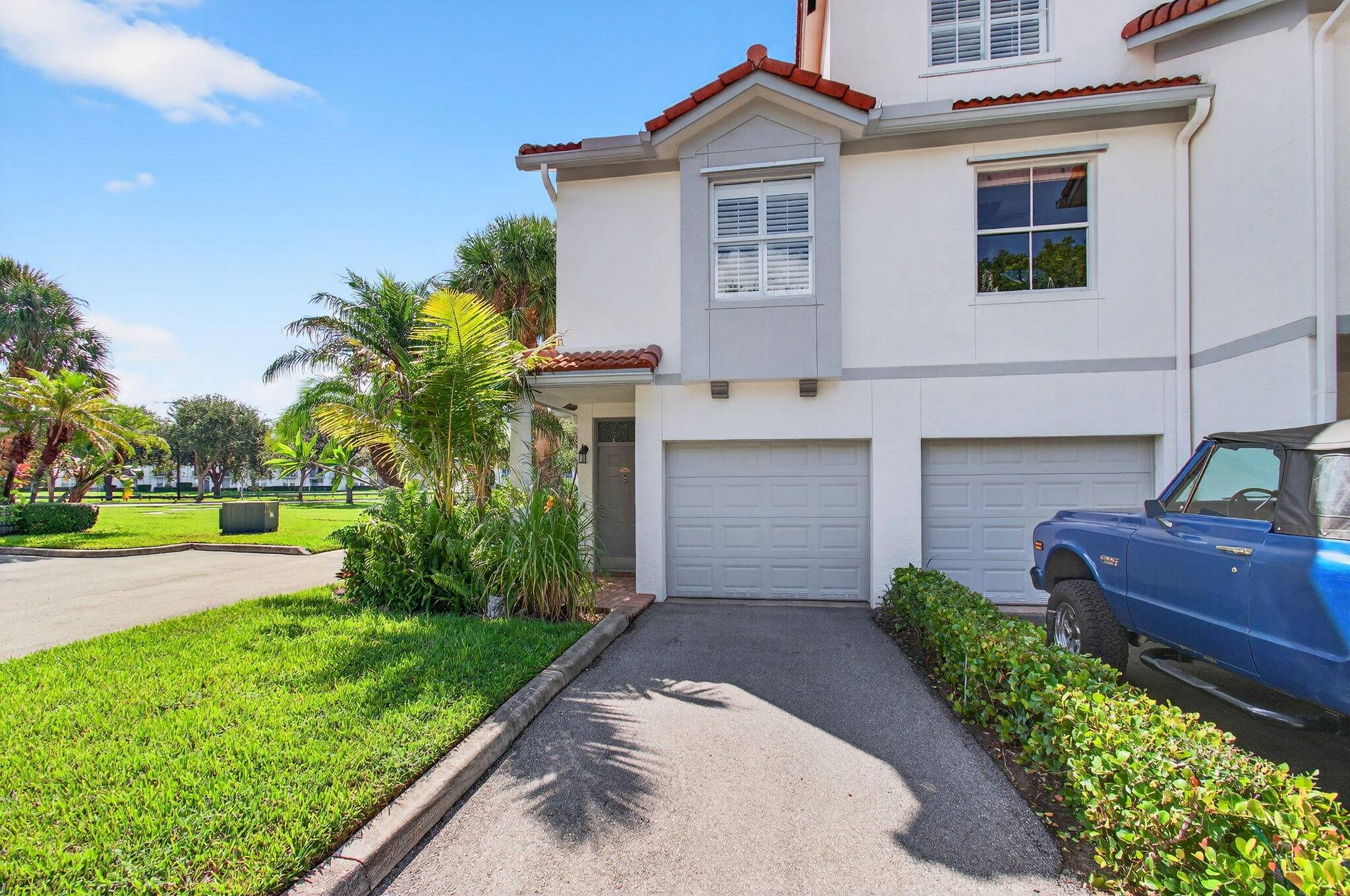 Well Maintained Corner Townhouse in Gated East Delray CommunityThis meticulously cared for corner unit townhouse offers a private garage and is located in a secure community with a wide range ...