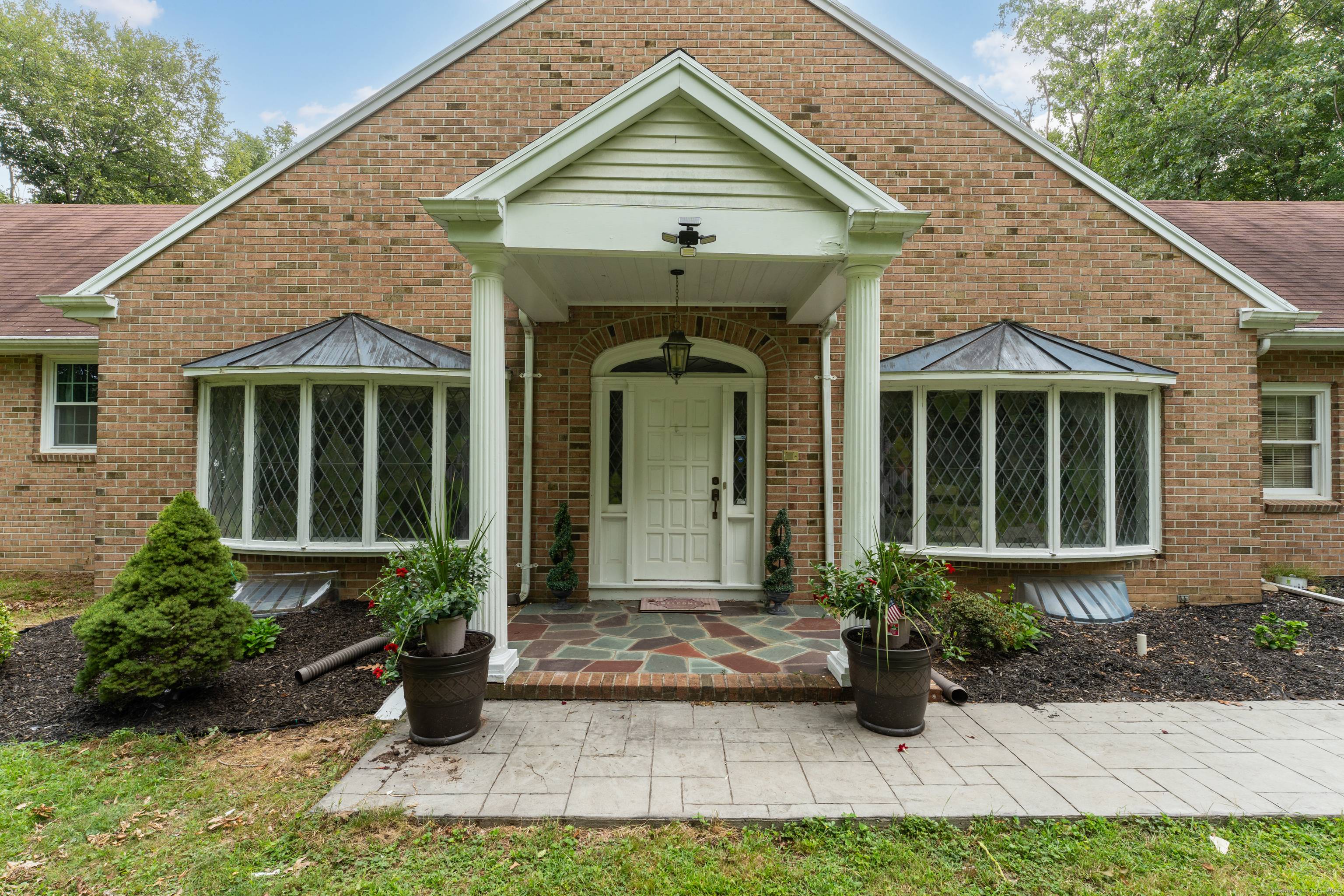 This custom built, large brick ranch home offers over 2, 700 square feet of living space and has potential for expansion on both the upper and lower levels.