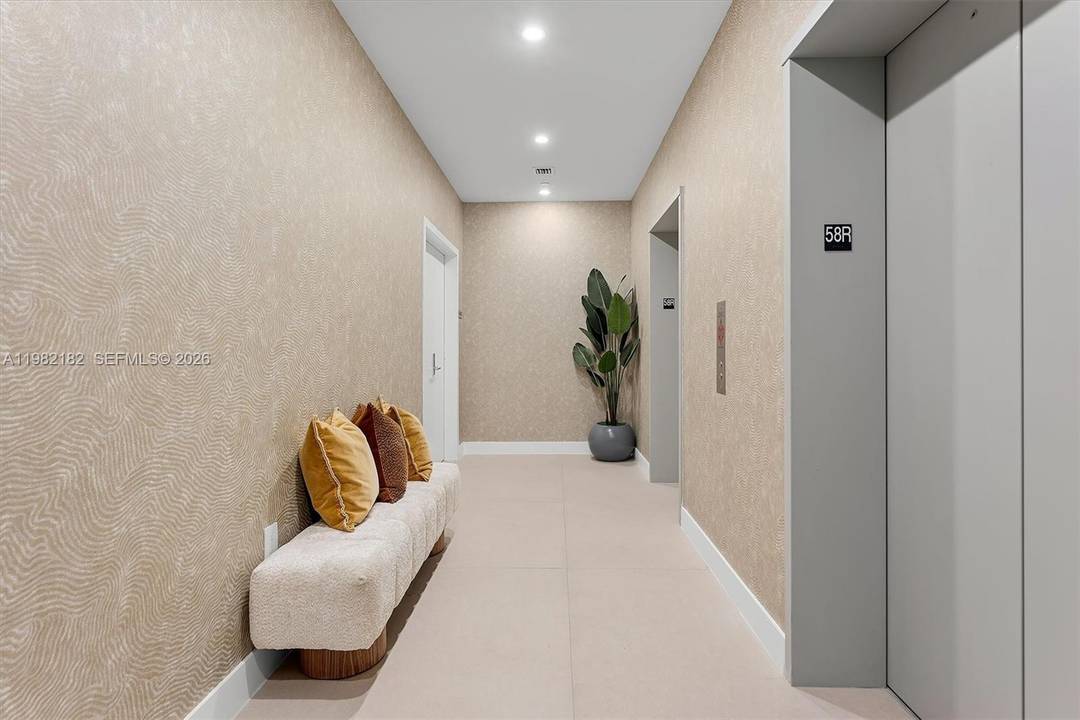 This luxury penthouse, newly built, has 11 foot ceilings and a spacious living room that opens onto a 10 foot balcony overlooking the sea.