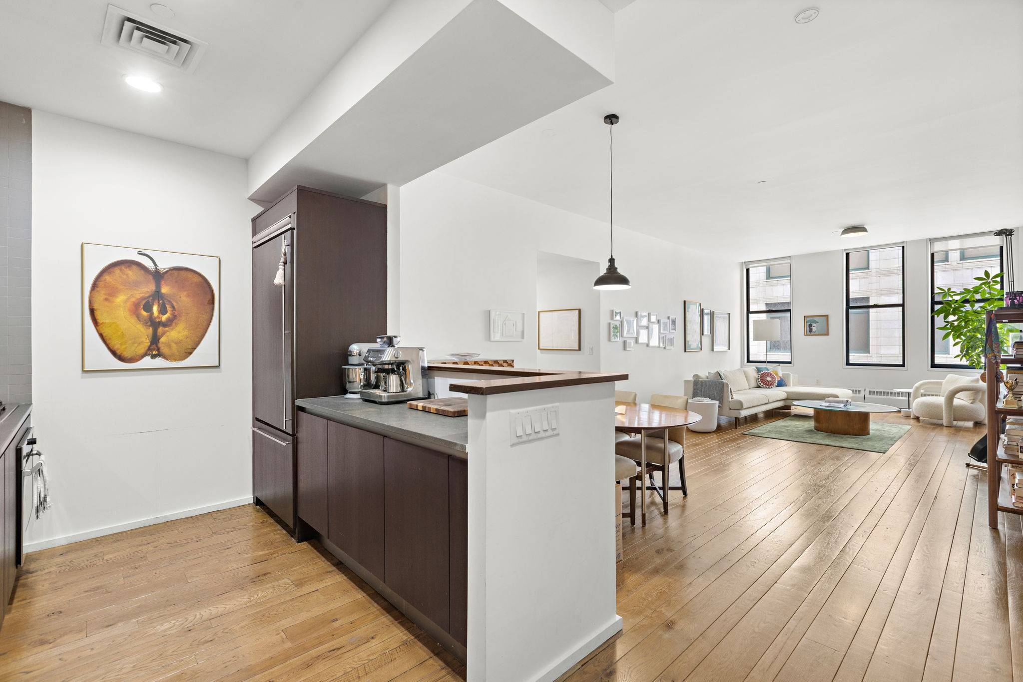 Discover unparalleled sophistication in this exquisite loft style residence at 21 Astor Place, Apt.
