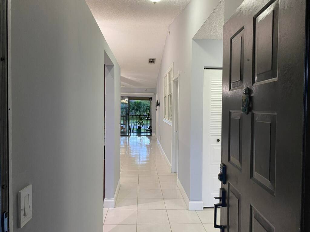 Spacious 2 bedroom, 2 bath condo plus a bonus enclosed room with a closet, perfect for an office or guest space.