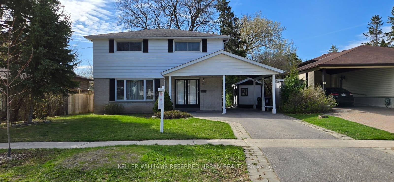 Indulge in classic luxury living, a rarely found residence nestled in a serene setting within a prestigious neighborhood.