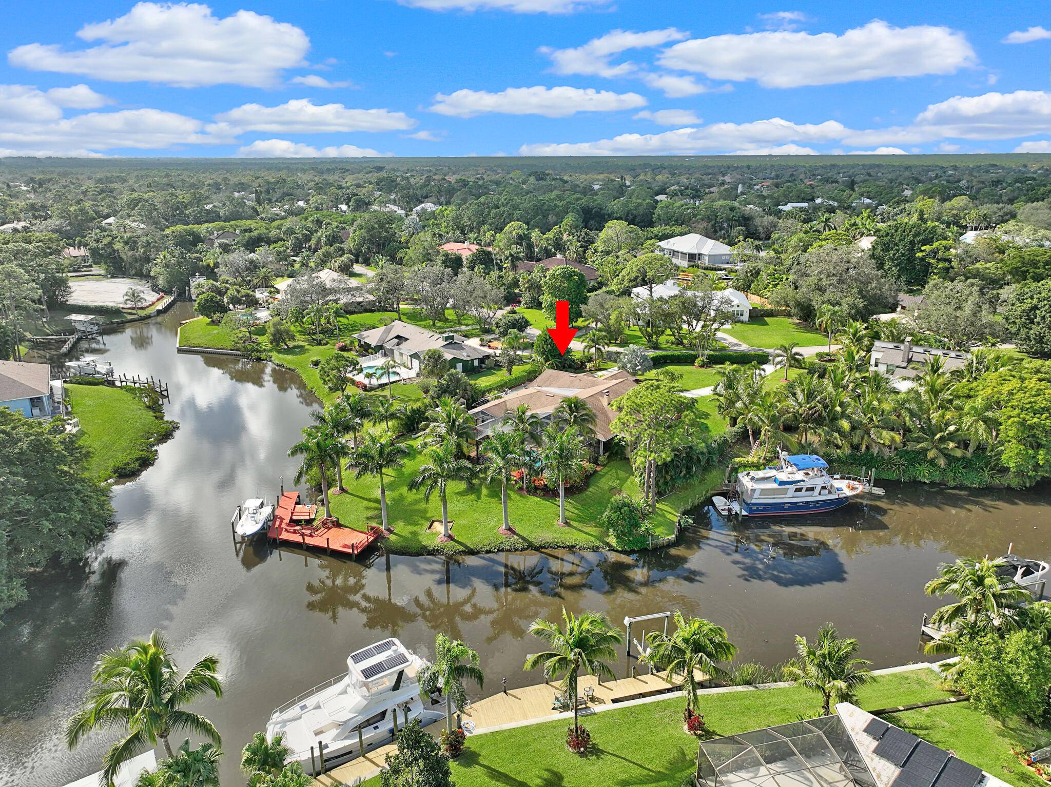 STUNNING WATERFRONT RETREAT in the sought after Four Rivers community !