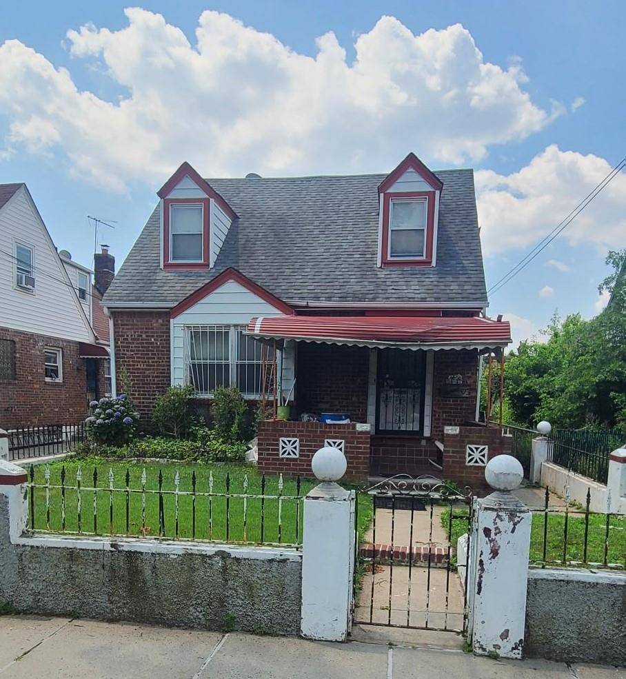 Detached 2 family Cape Cod that sits on nice lot that offers off street parking.