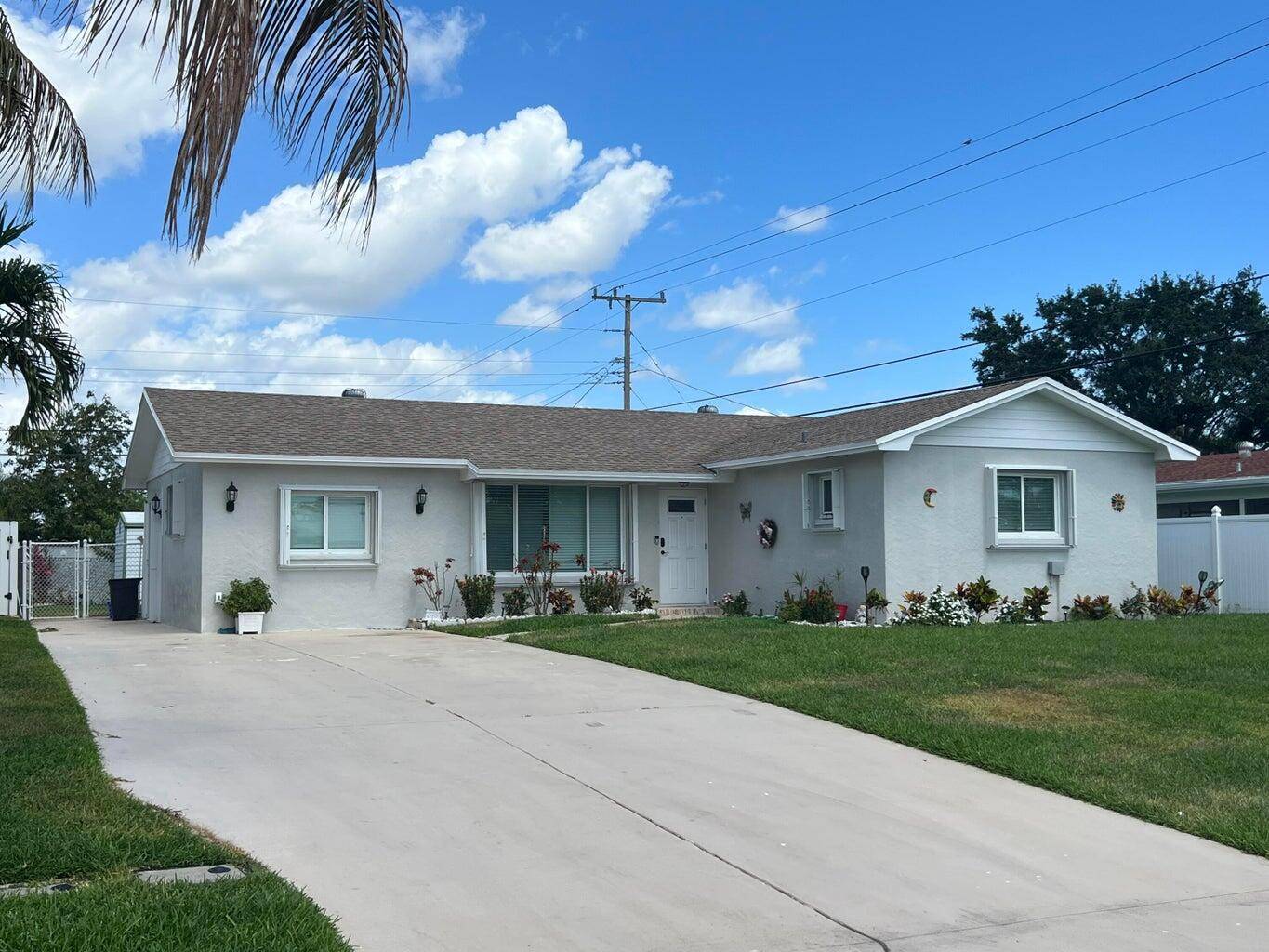 One story ranch style home with 4 bedrooms and 2 baths in the heart of Palm Beach Gardens with no HOA.