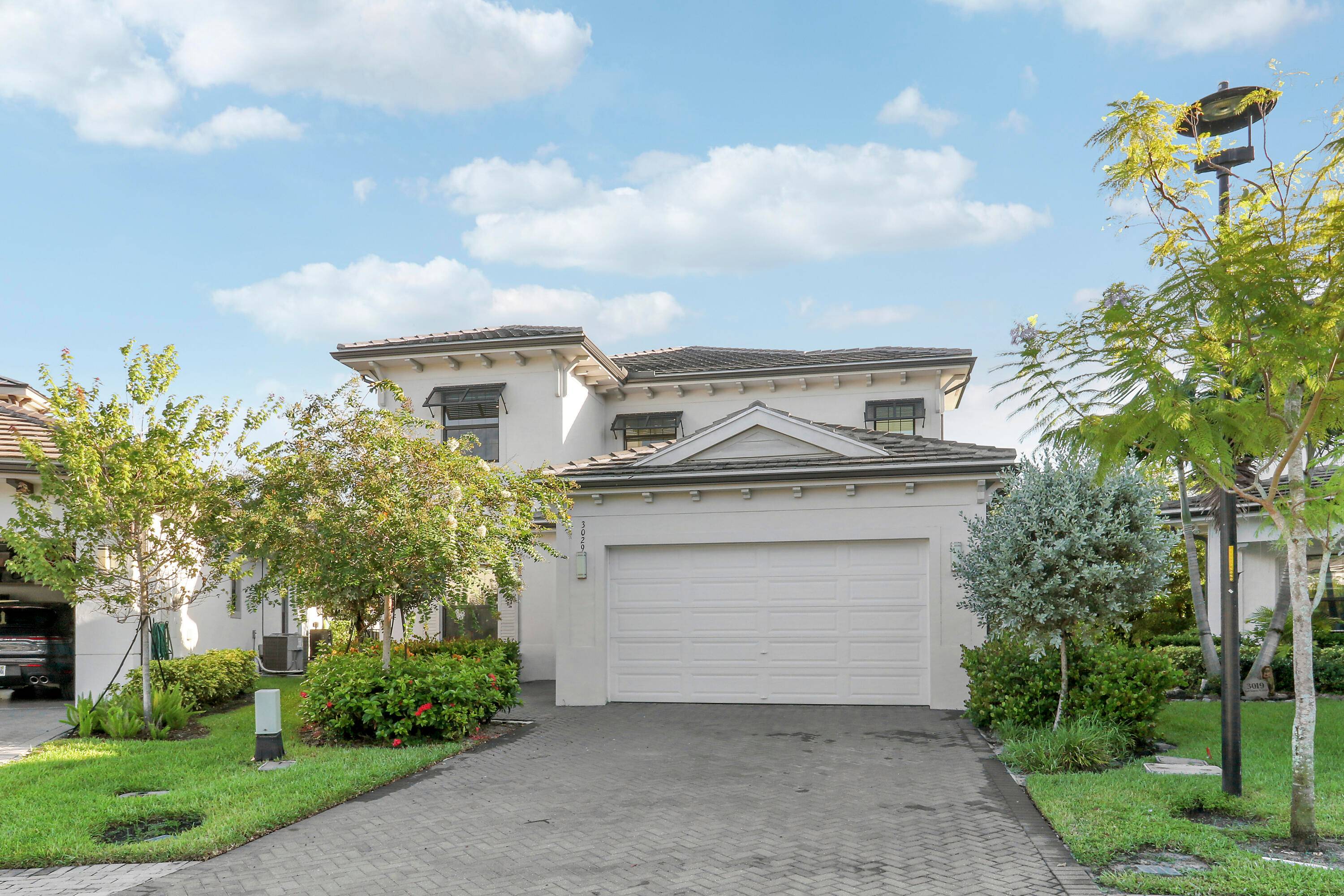 Welcome to the gated community of Banyan Cay, where luxury living meets modern design.