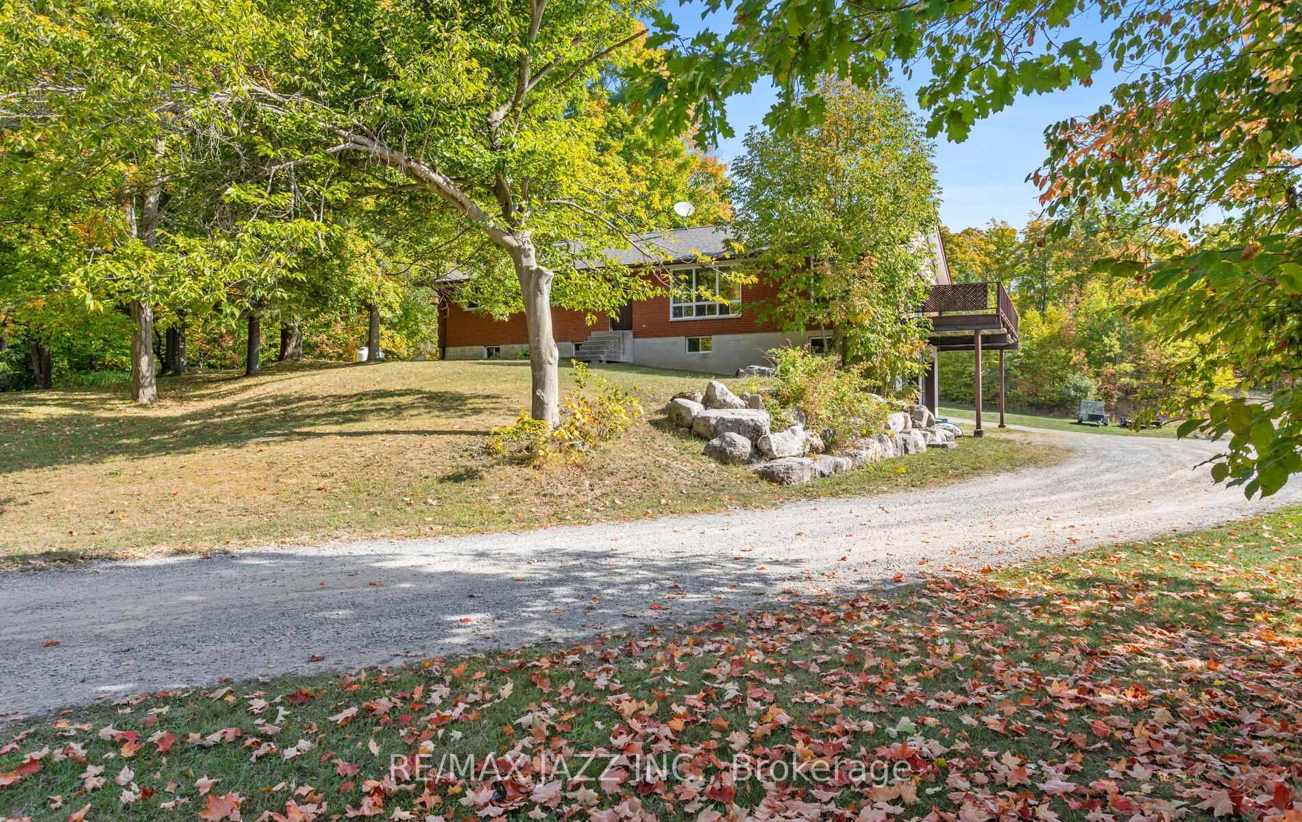 Spectacular all brick bungalow on 4 Acres in a very desirable location with a 50 x 100 ft.