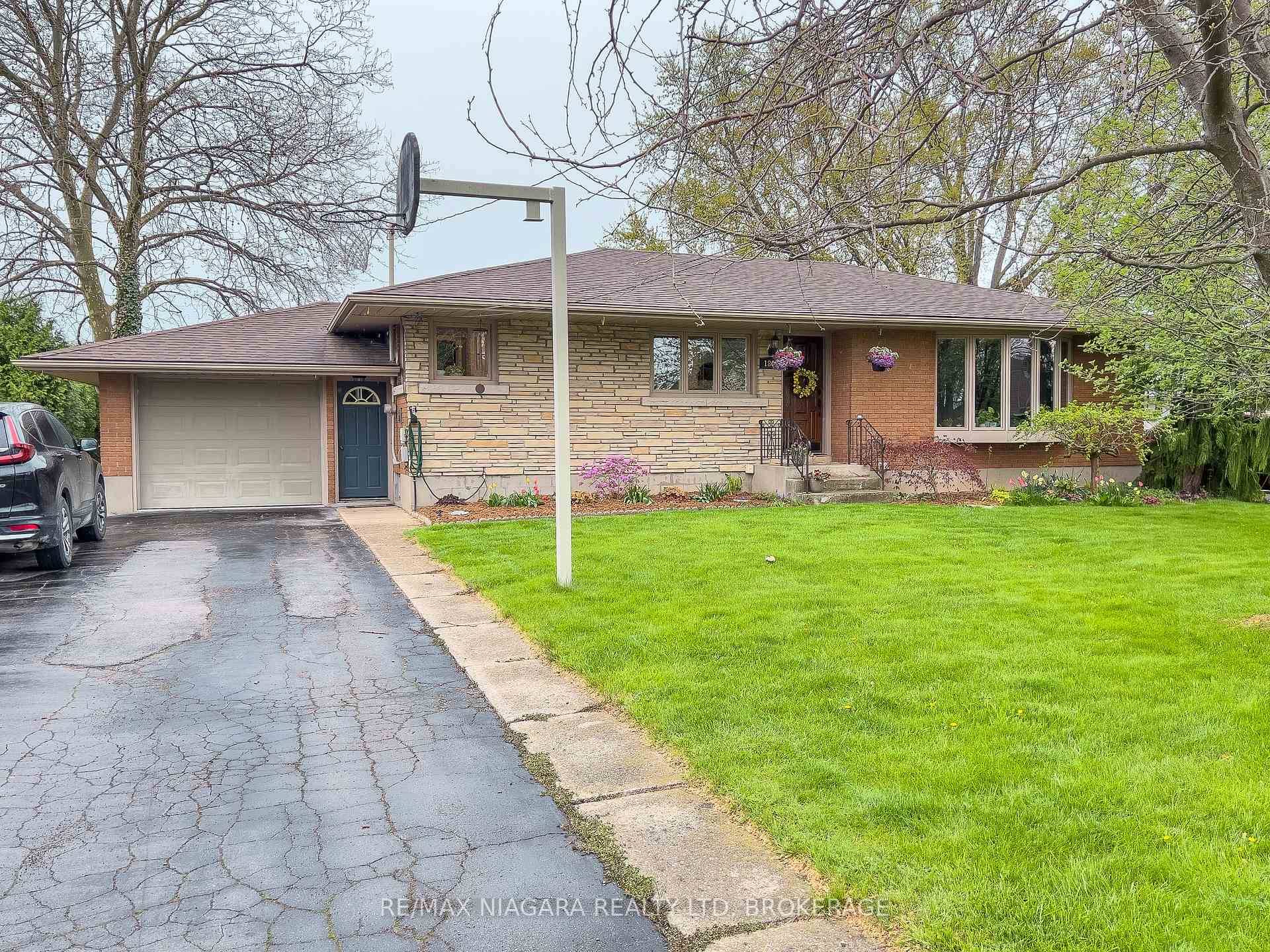 Great country in the city feel in this meticulously maintained 2 1 bedroom brick bungalow on a large 75 x 150 lot with orchards on 2 sides and lush perenial ...