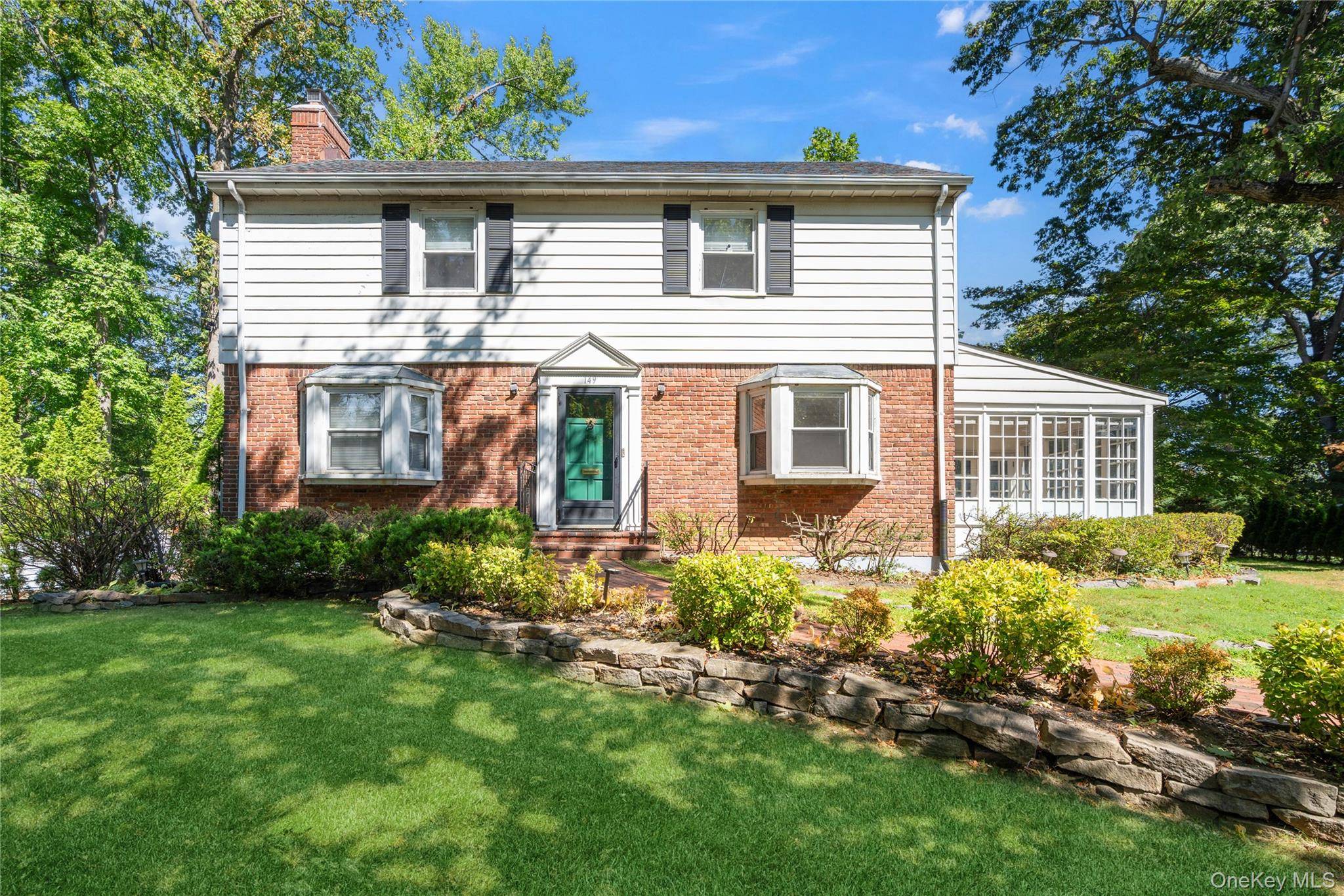 Charming 3 bedroom, 2. 5 bathroom south facing brick Colonial.