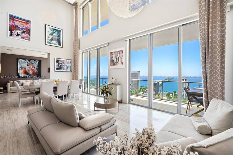 Penthouse 207 is a two story residence offering expansive interior volume and architectural presence in a prime Midtown Miami location.
