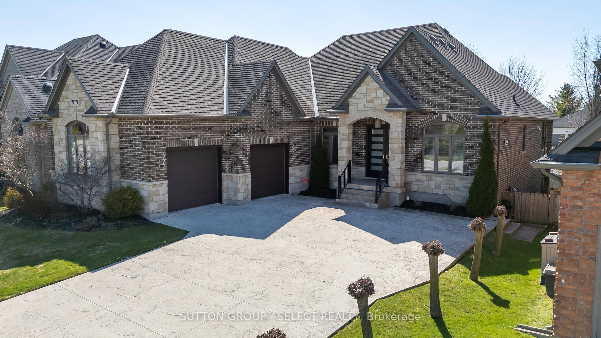 Striking Executive Living on Greenspace with Walkout amp ; Courtyard Garage.