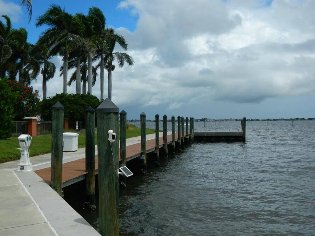FABULOUS OPPORTUNITY to OWN A DOCK SLIP with a LIFT in this PROTECTED MARINA OFF the INTER COASTAL in JENSEN BEACH !