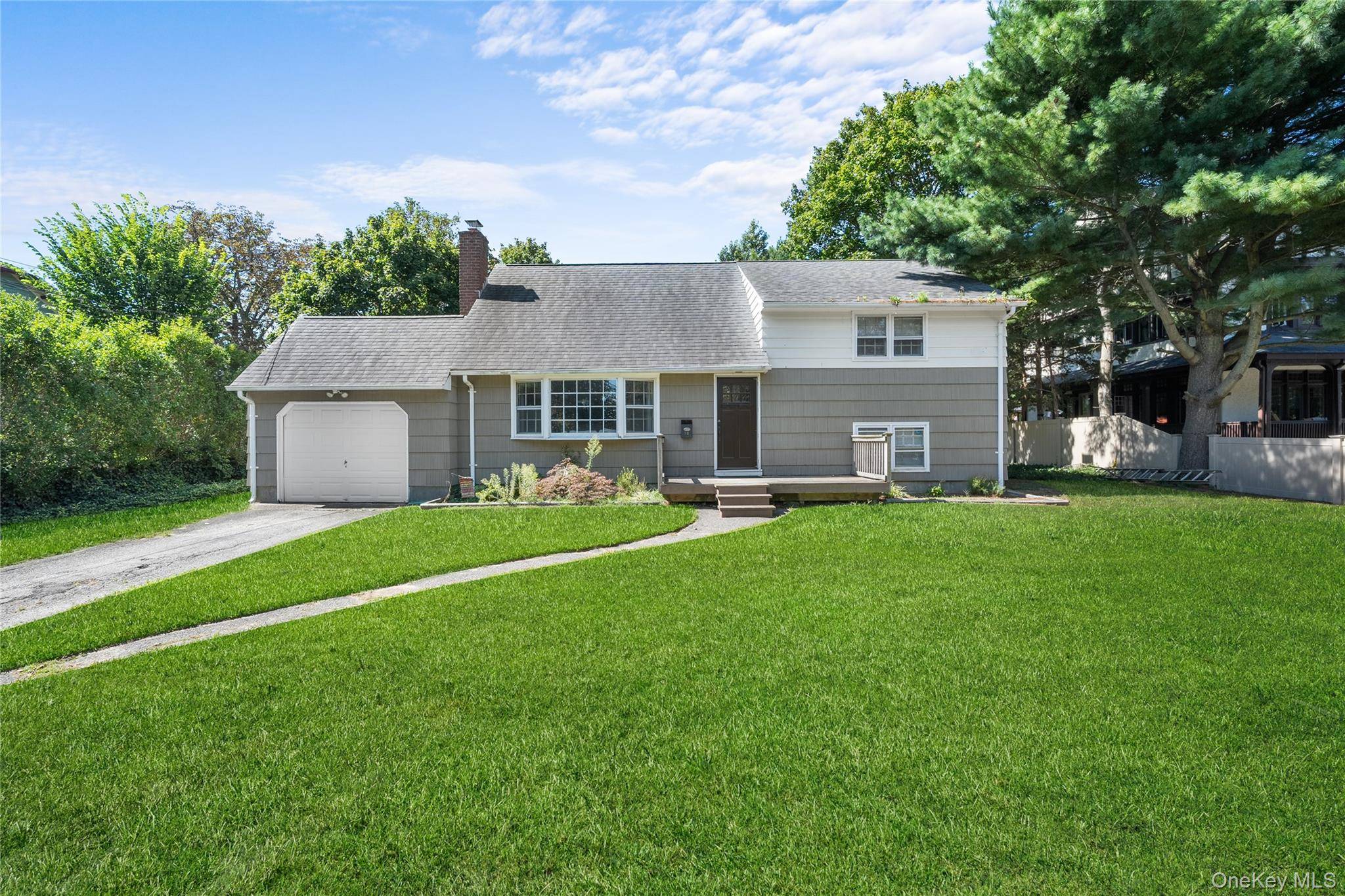 Welcome to 68 Ocean Ave, a charming 3 bedroom, 2 bath split level home with endless potential !
