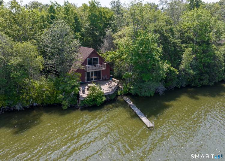 A Seasonal rental 2027 Whisk off to your own private Green Mountain Chalet nestled on the shores of a quiet Connecticut lake !