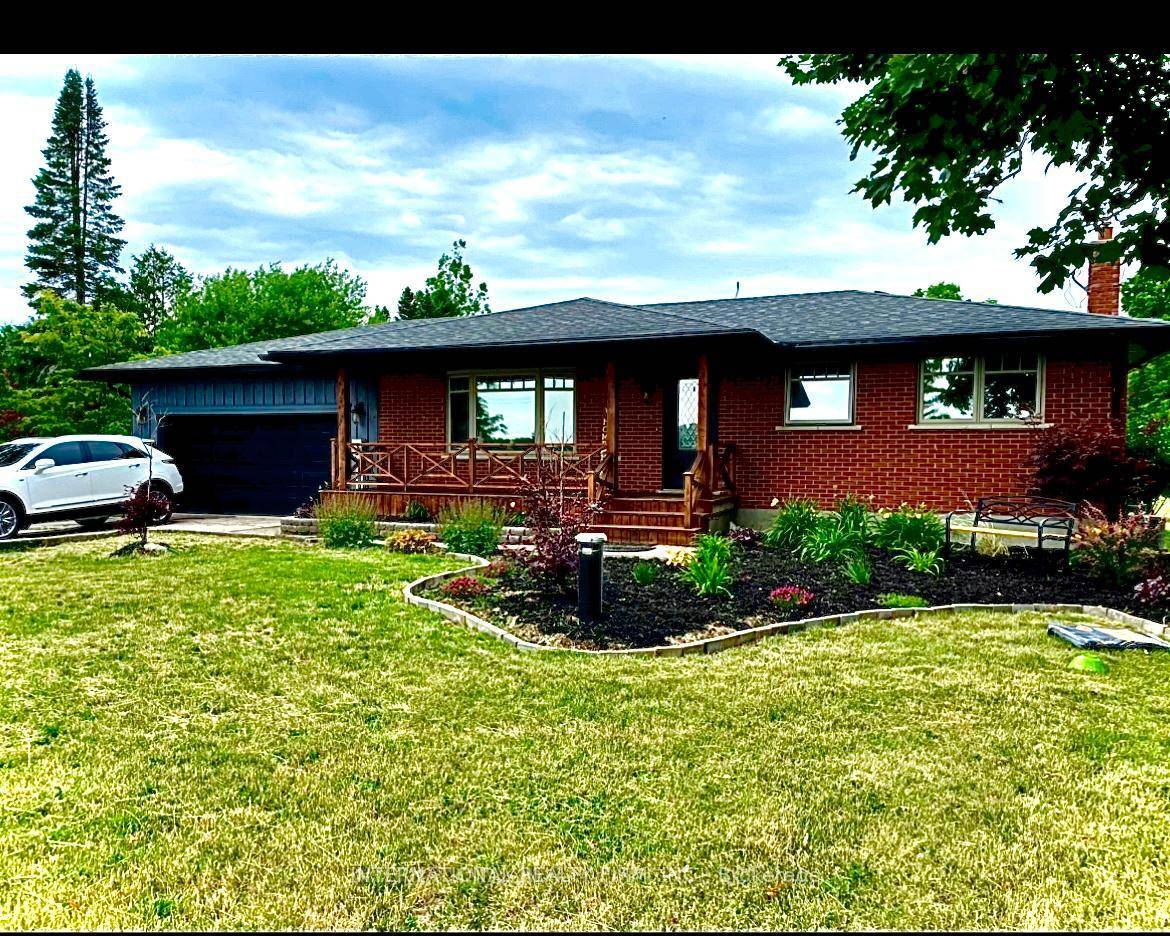 Discover this beautifully maintained 3 1 bedroom, 2 bathroom bungalow set on a private, manicured one acre lot in the heart of Erin.