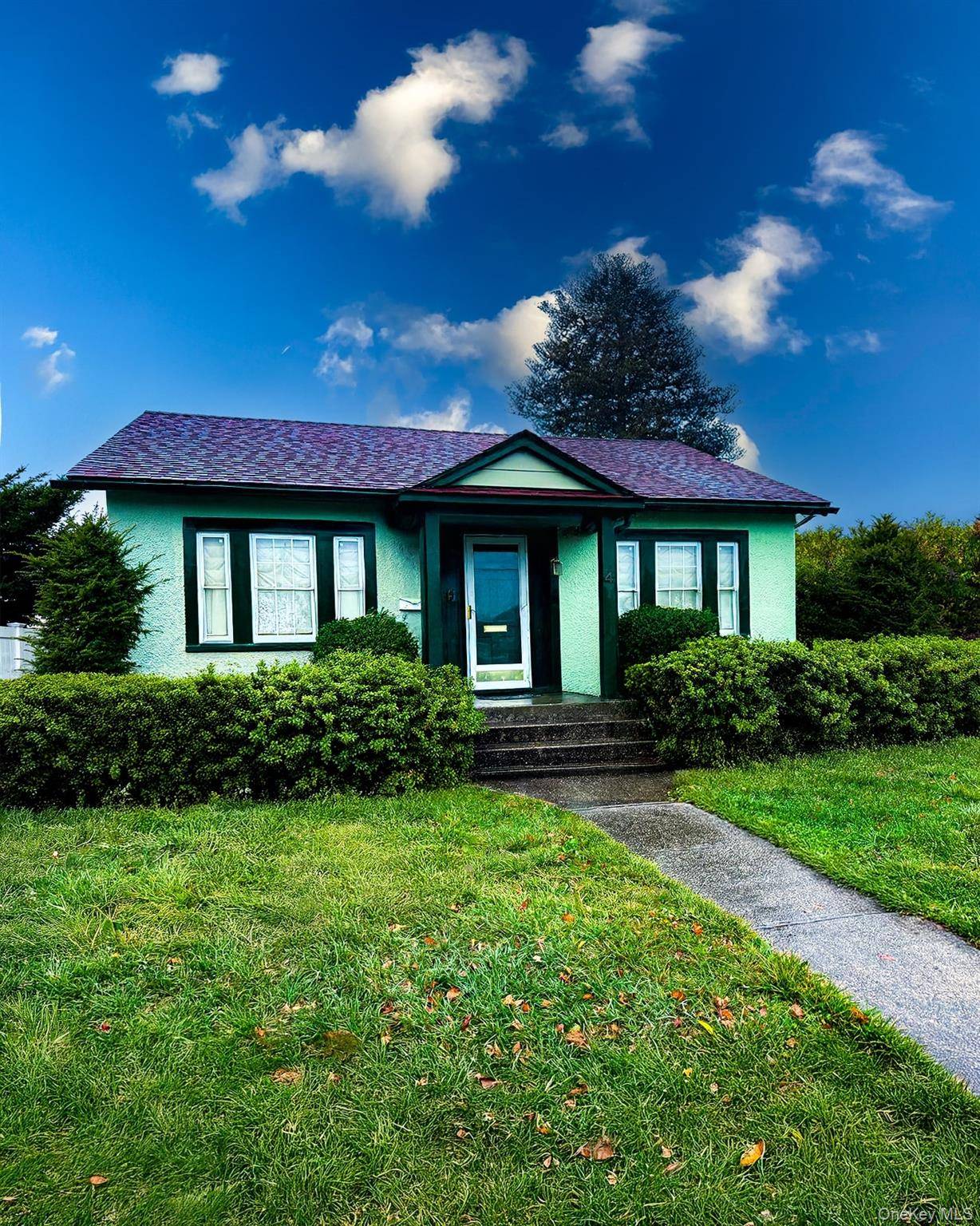 Charming ranch style home in the heart of Hicksville offering spacious living with a private yard.