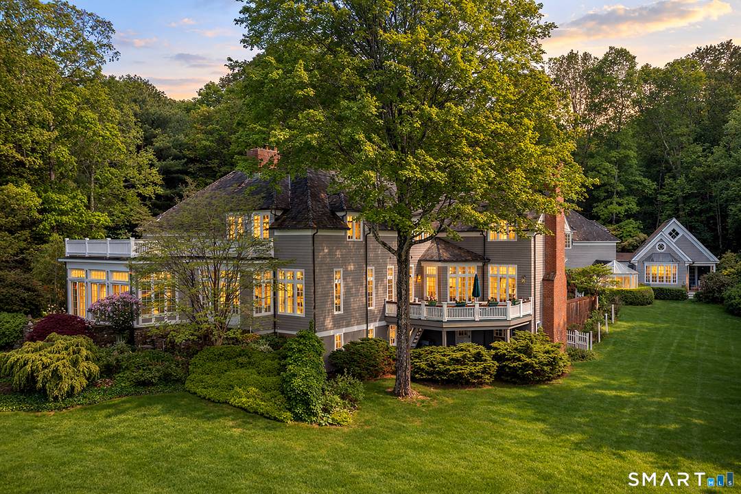 A private gated road leads to this elegant shingle style estate on 20 secluded acres in the beautiful Litchfield Hills with spectacular views that go on for miles.