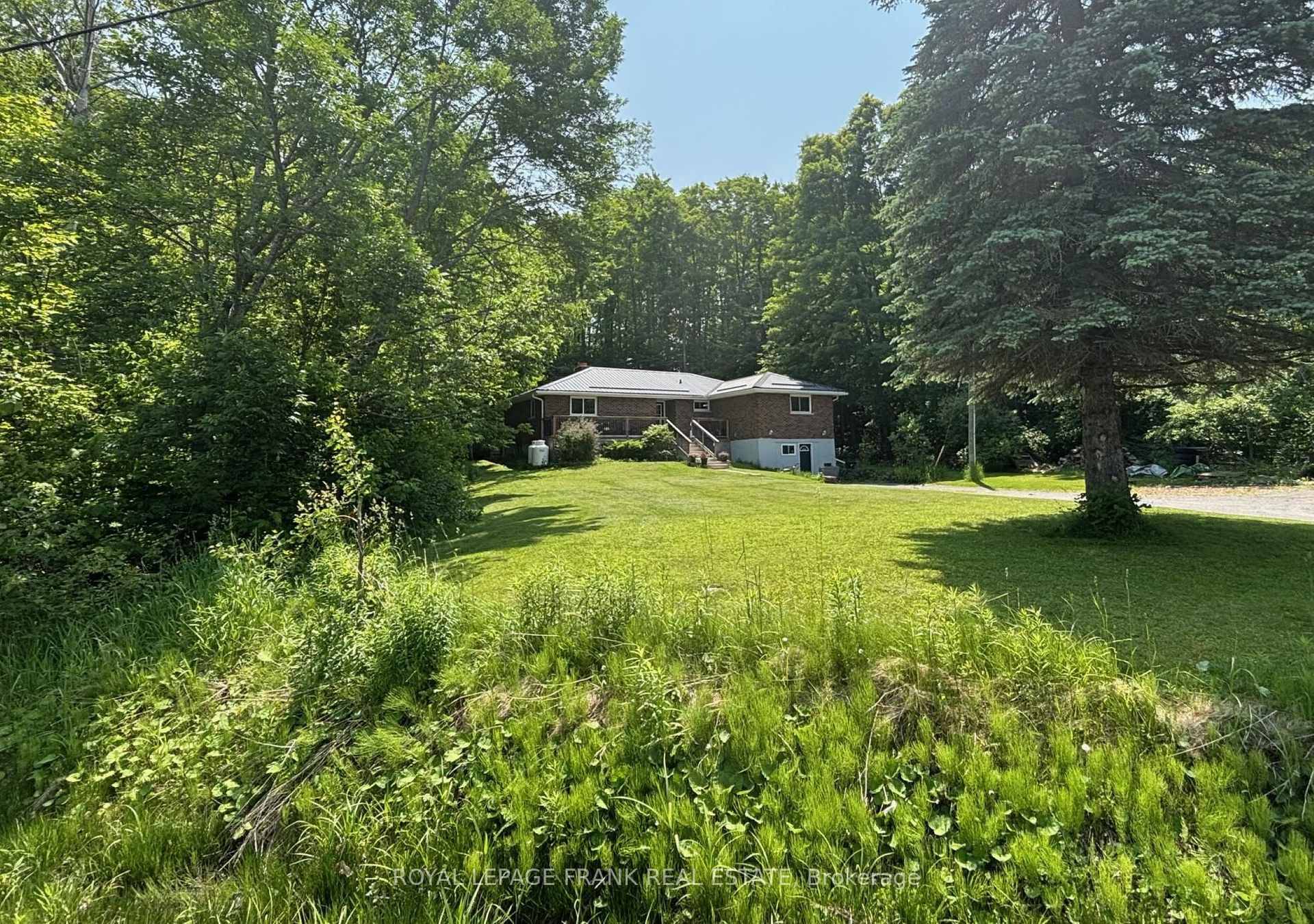 Three plus one bedroom bungalow on a beautifully treed, 3 4 acre lot within 15 minutes of Peterborough and close the Village of Warsaw.