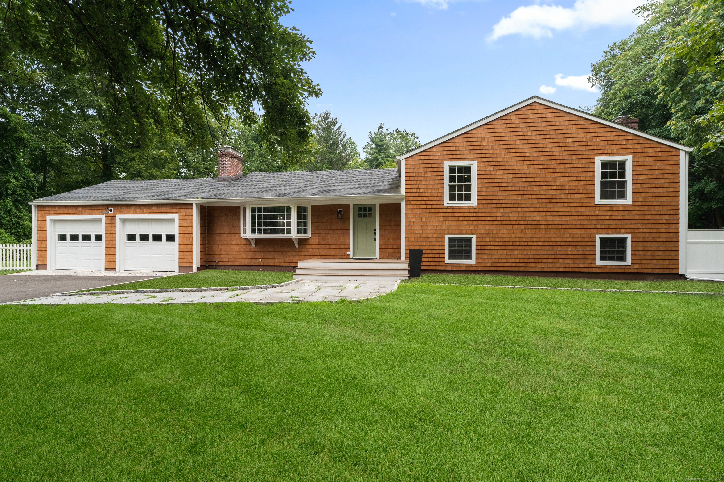 Welcome to this fully renovated West Norwalk retreat.