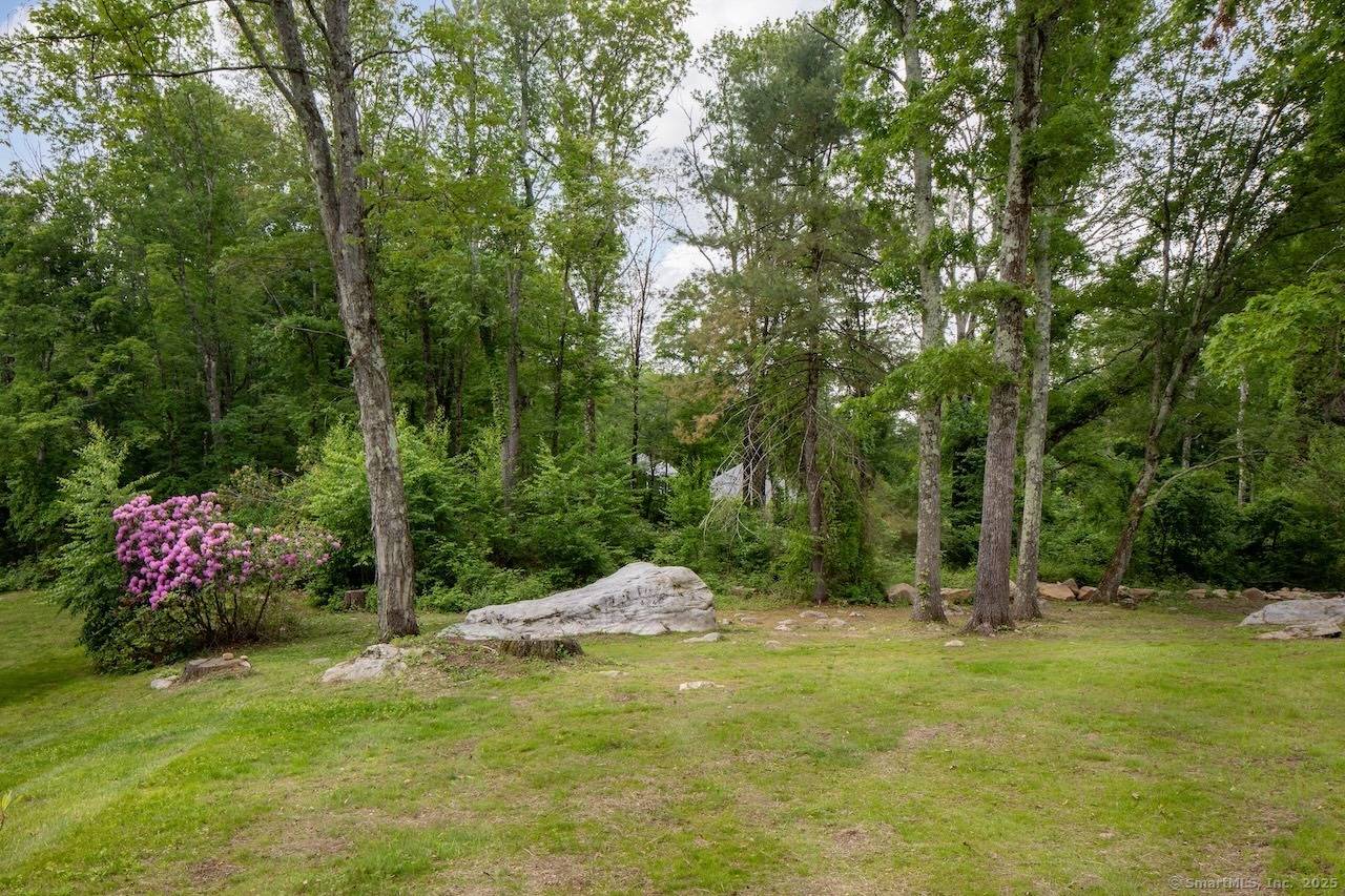 Renovated Sharon Home with Guest Apartment Situated on over 2 beautifully landscaped acres, this adaptable 3 bedroom, 2.