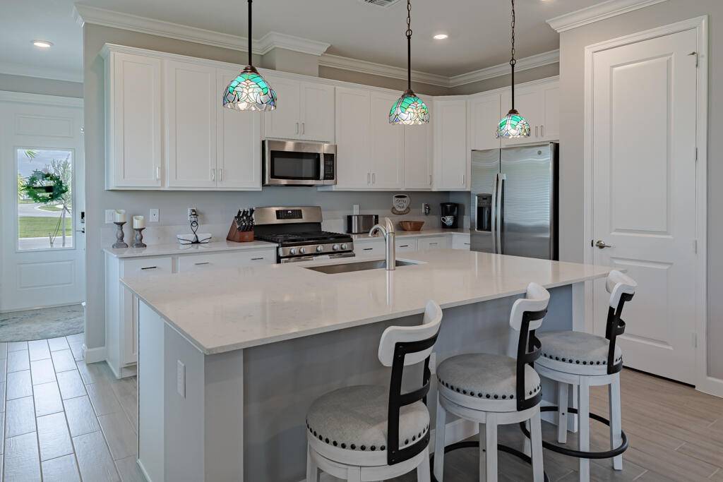 Live the ultimate Florida lifestyle in this immaculate 3 2 2 CBS home within the gated, vibrant 55 community of Veranda Preserve !