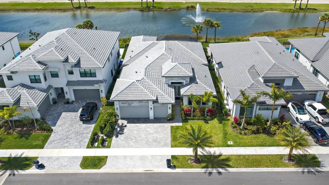 Better than new and exceptionally upgraded, this stunning Adonis model in Apex at Avenir offers refined modern design, premium finishes, and breathtaking west facing water views with unforgettable sunsets.