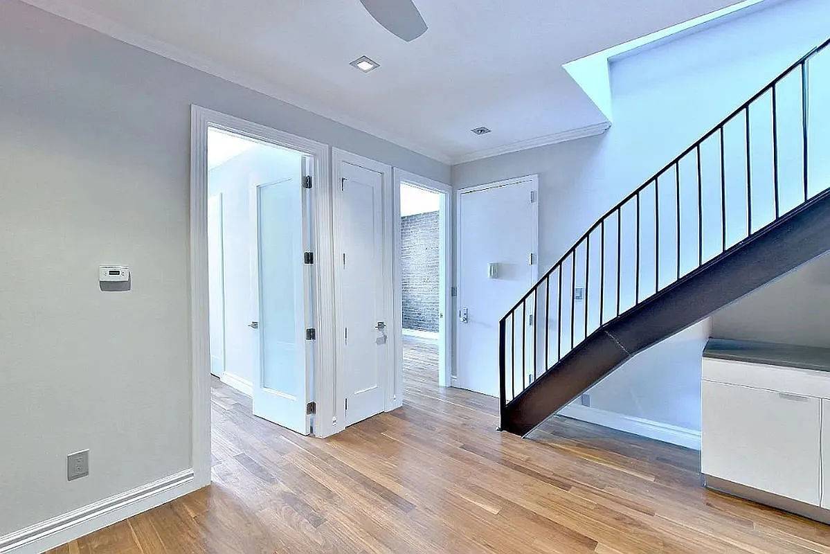 This updated four bedroom, two bath residence offers a seamless blend of style and function, featuring a private roof deck, modern kitchen, and in unit washer and dryer.