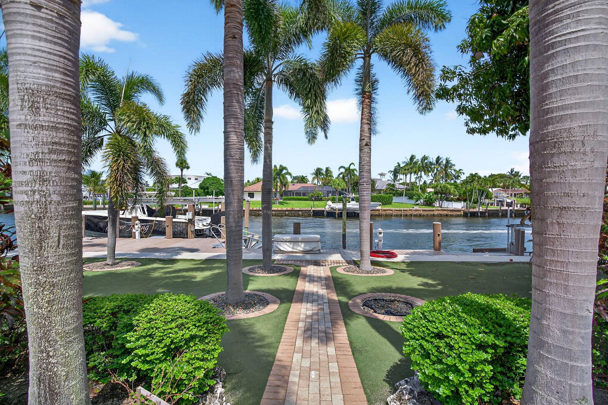 A Waterfront Oasis ! 4 bed 3 bath waterfront pool home on one of the most desirable streets in the VIllage of NPB !