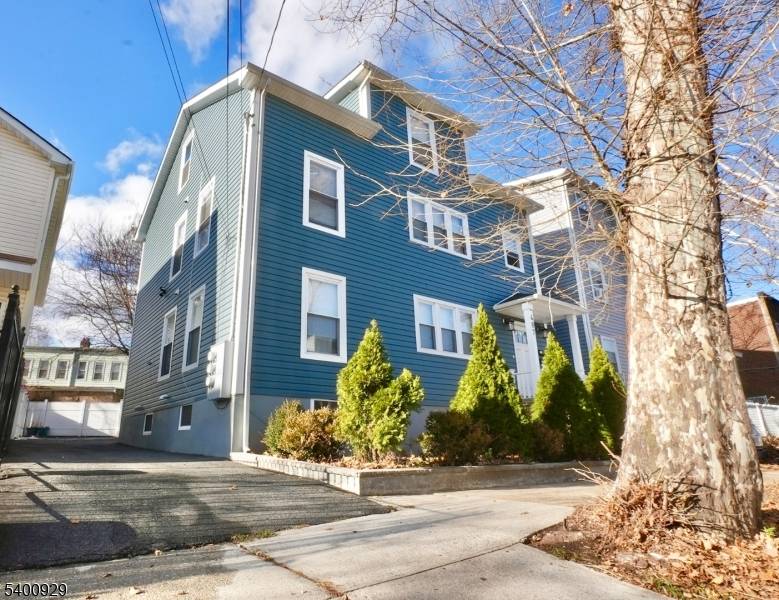 Welcome to this beautifully maintained two family home nestled on a residential block in Newark.