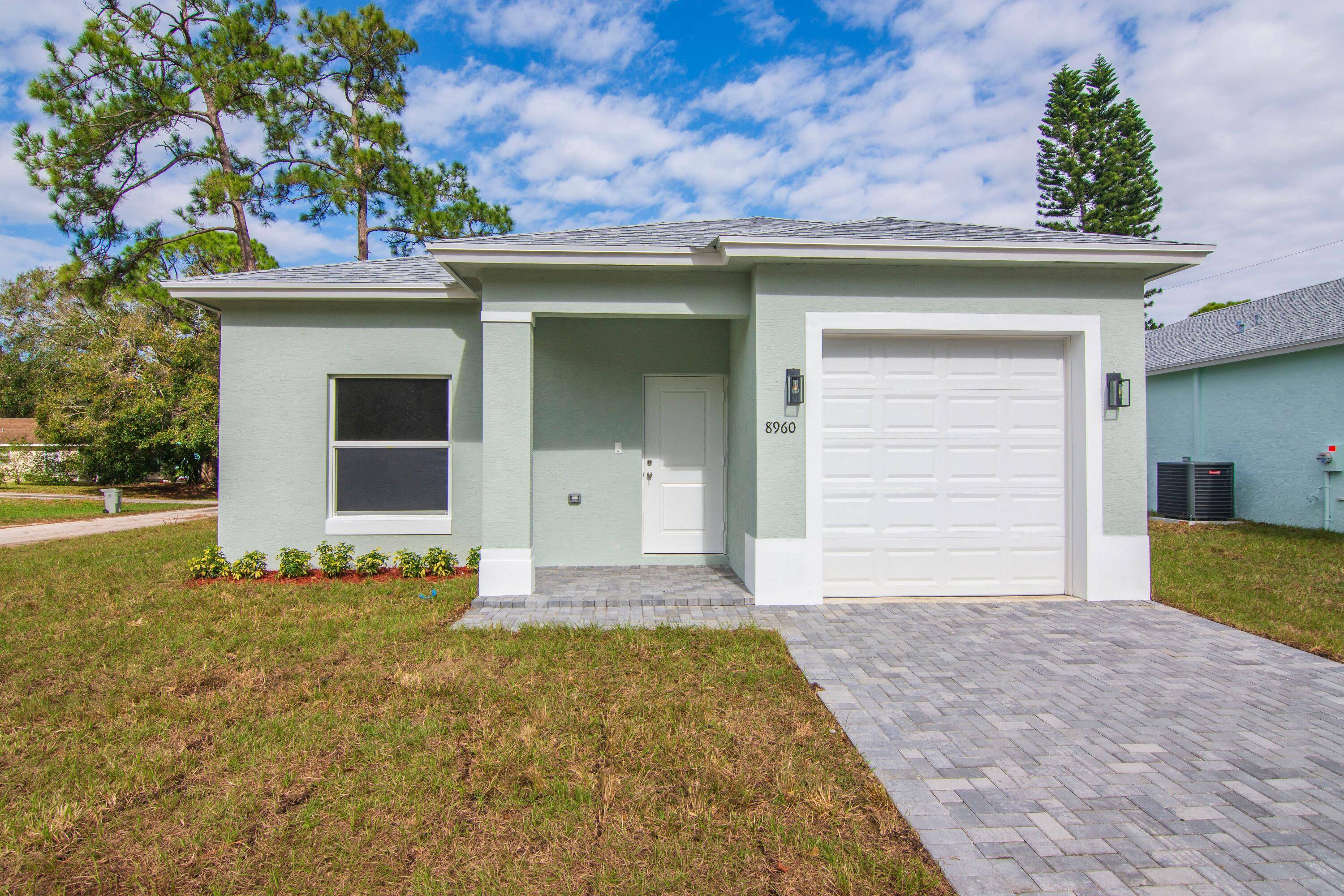 READY NOW ! ! 3 bedroom, 2 bath concrete block home, with IMPACT WINDOWS, all tile flooring, Corian kitchen counter tops, stainless steel appliances, and more near ocean, river, shopping, ...