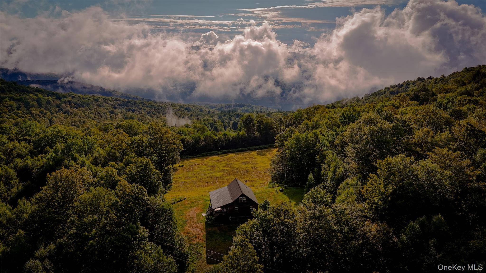 The Emerald Heights Chalet is set high above the Pepacton Reservoir in Downsville, NY, with epic views and unmatched privacy.