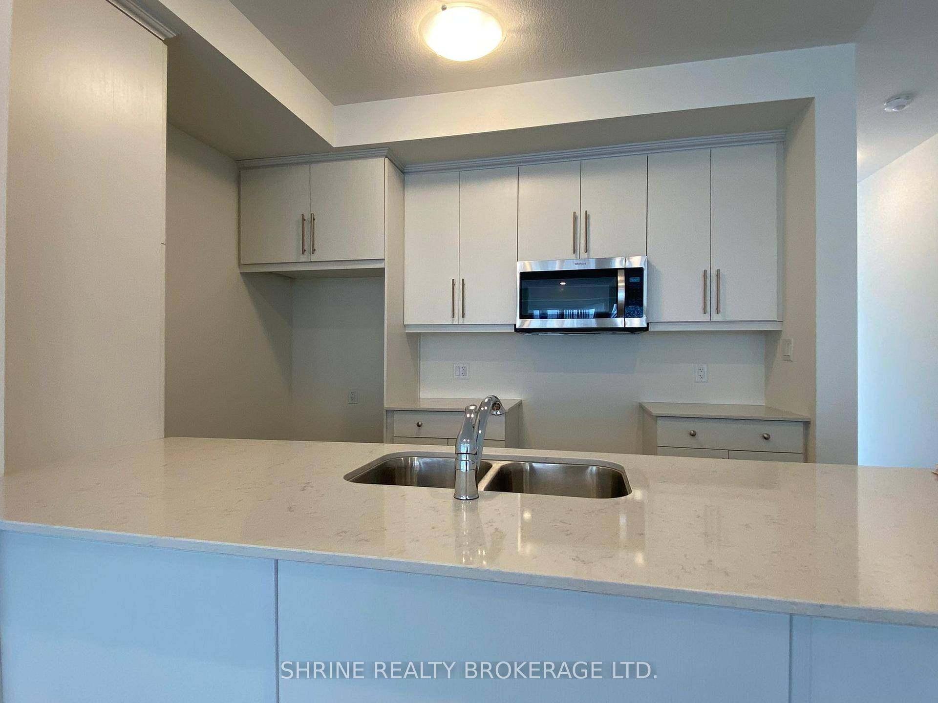 Welcome to this bright and modern townhome offering an open concept kitchen, dining, and living area filled with natural light, plus a convenient main floor powder room.