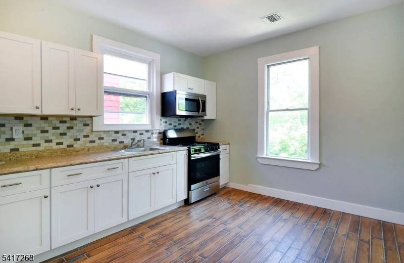 Discover the perfect blend of income potential and convenient living with this impressive six bedroom, two bathroom multi family property with a bonus finished attic.