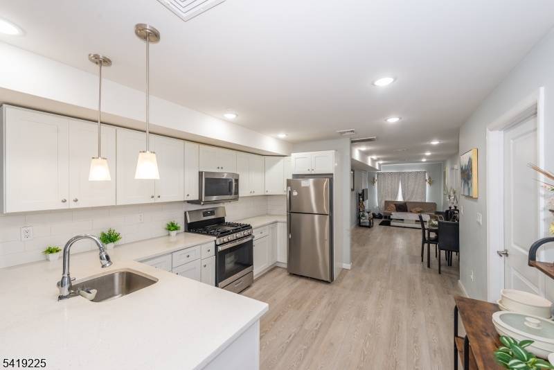 Experience the pinnacle of modern investment with this rare, totally rebuilt 2024 three family masterpiece.