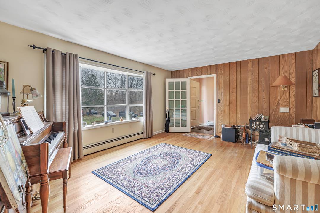 Welcome to this expanded well maintained ranch style home, lovingly cared for by its owners and nestled on an expansive 1.