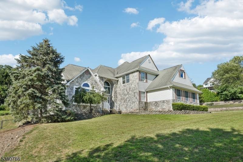 Welcome home to this exquisite 6 bedroom, 5.