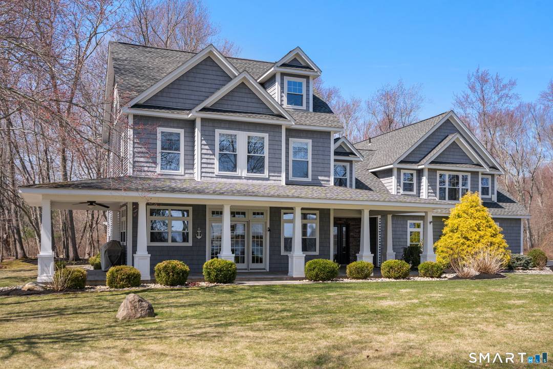 Set on a rare 7 private acres at the point of Coventry Lake, this extraordinary waterfront retreat captures the feeling buyers dream about but almost never find.